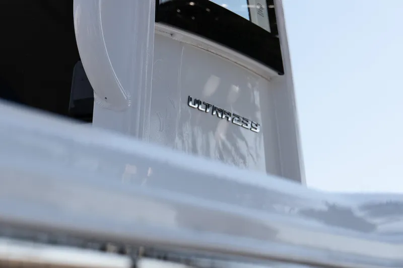 Slide: The Image of 2023 Sea Hunt Ultra 239 SE boat emblem close-up. - 8
