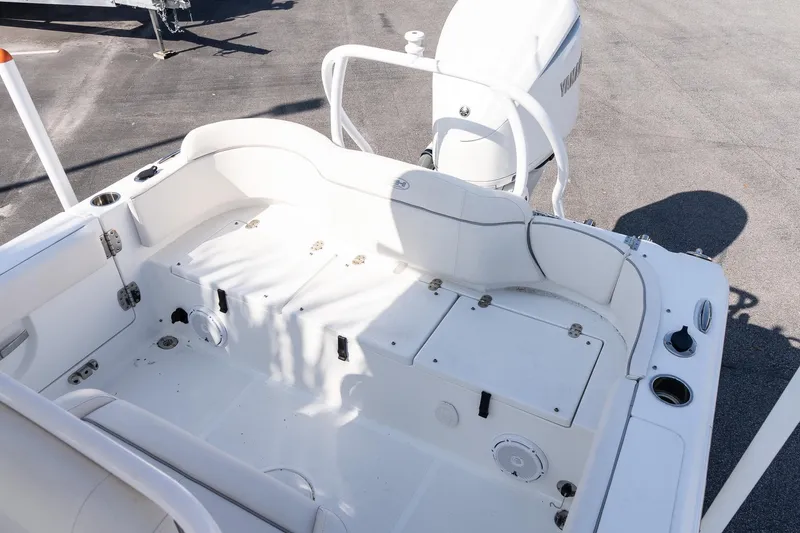 Slide: The Image of 2023 Sea Hunt Ultra 239 SE boat interior with seating and storage compartments. - 9