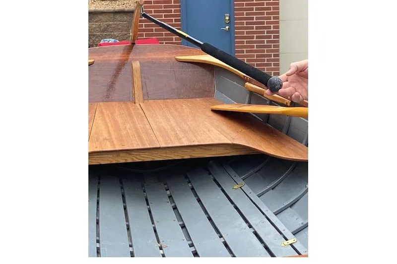 Slide: The Image of Wooden interior of 2019 HOME BUILT Cat's Paw boat with oars and paddle. - 10