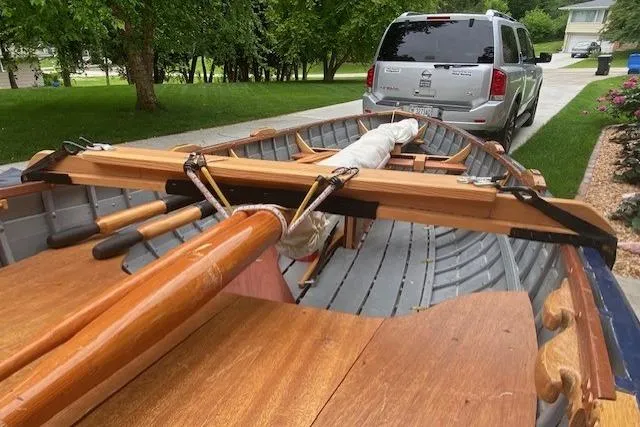 Slide: The Image of Home-built 2019 Cat's Paw wooden boat on trailer, parked in residential driveway. - 7