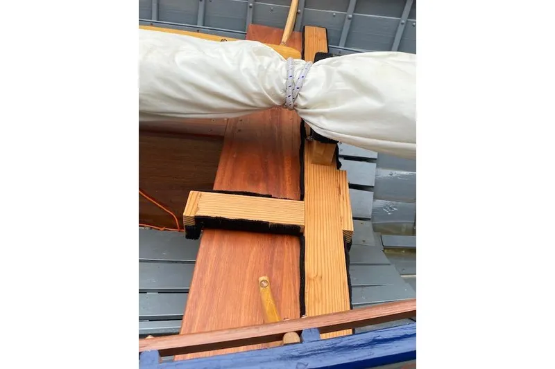 Slide: The Image of Wooden interior of 2019 HOME BUILT Cat's Paw boat with sail detail. - 8