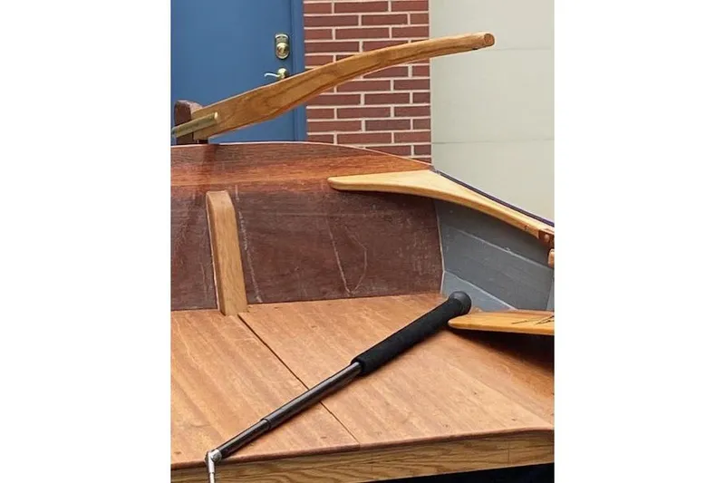 Slide: The Image of Wooden interior of 2019 HOME BUILT Cat's Paw boat with oars and tiller. - 9