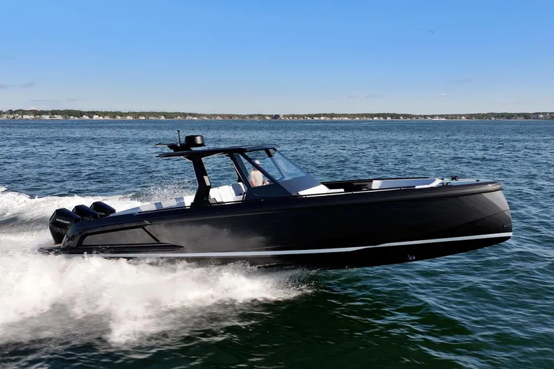 The Image of 2024 Vanquish Yachts 40 cruising on open water, showcasing sleek design and powerful performance. - 0
