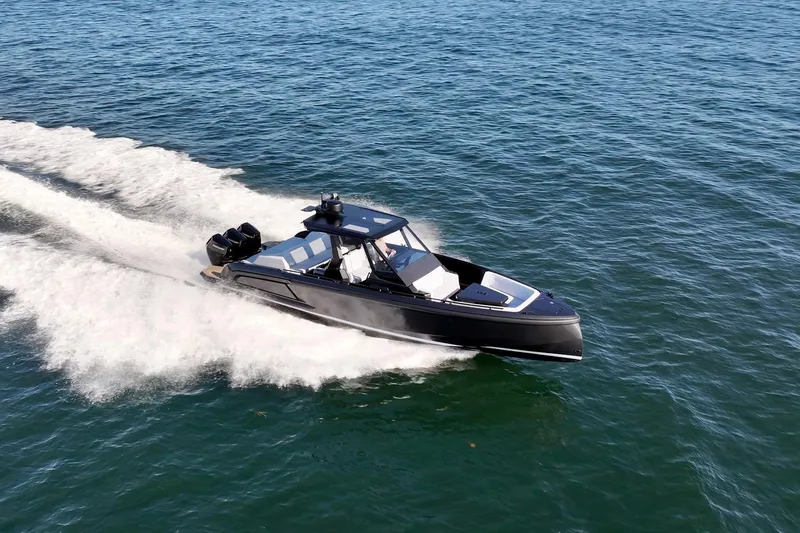Slide: The Image of 2024 Vanquish Yachts 40 cruising swiftly on open water. - 10