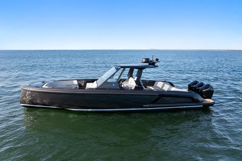 Slide: The Image of 2024 Vanquish Yachts 40 on open water, sleek design, modern luxury boat. - 23