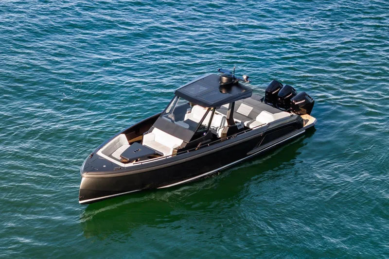 Slide: The Image of 2024 Vanquish Yachts 40 luxury boat on open water, sleek design, powerful engines. - 26