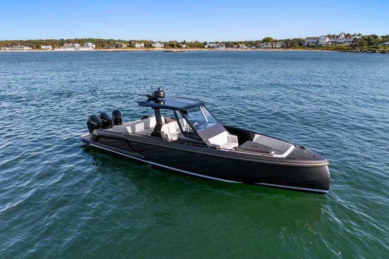 Slide: The Image of 2024 Vanquish Yachts 40 on serene water, showcasing sleek design and luxury features. - 28