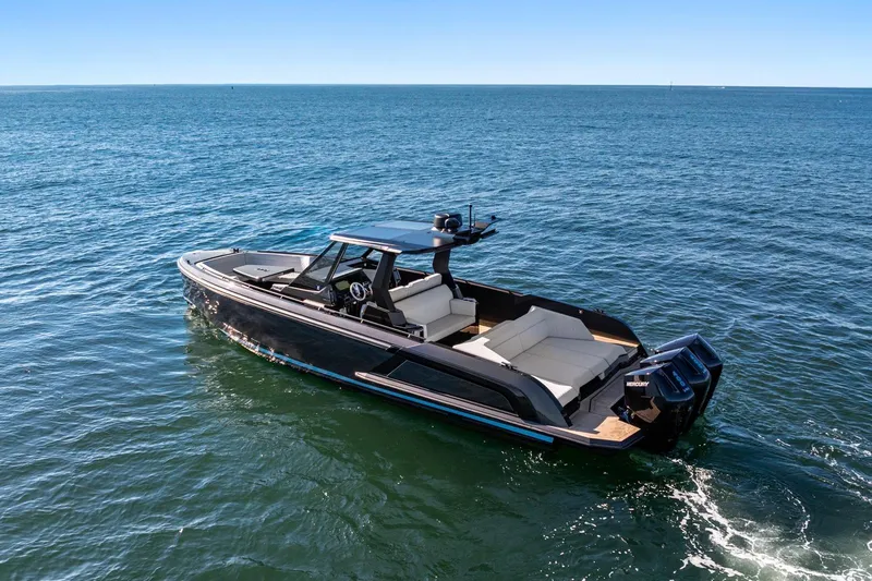 Slide: The Image of 2024 Vanquish Yachts 40 cruising on open water, showcasing sleek design and luxury features. - 31