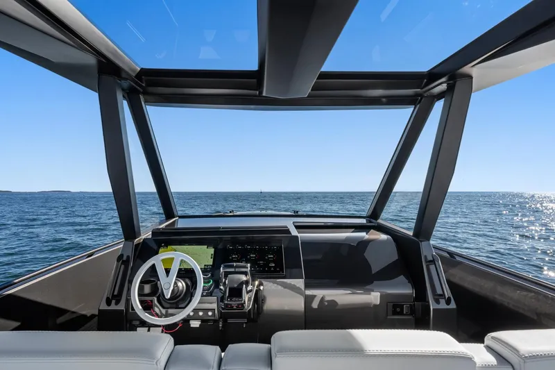 Slide: The Image of Interior view of 2024 Vanquish Yachts 40, showcasing modern helm and ocean horizon. - 35