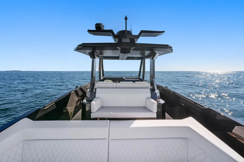 Slide: The Image of 2024 Vanquish Yachts 40 on open sea, featuring sleek design and luxurious seating. - 36