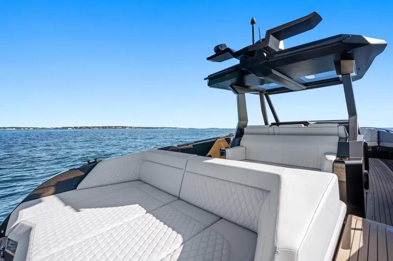 Slide: The Image of Luxurious 2024 Vanquish Yachts 40 with elegant seating, cruising on open water. - 37