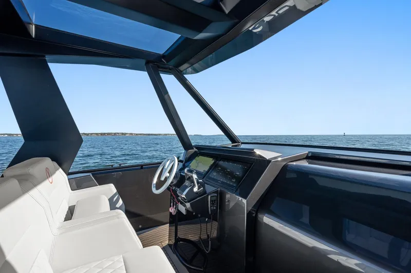 Slide: The Image of Interior view of 2024 Vanquish Yachts 40, featuring sleek design and ocean backdrop. - 41