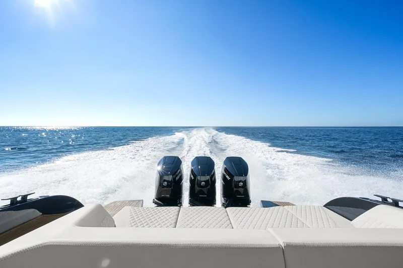 Slide: The Image of 2024 Vanquish Yachts 40 cruising on open sea with powerful triple engines. - 43