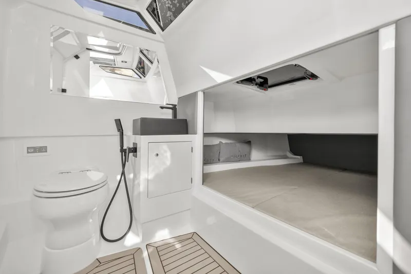 Slide: The Image of Luxurious 2024 Vanquish Yachts 40 interior with modern bathroom and sleeping area. - 44