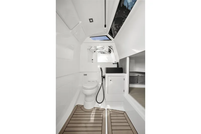 Slide: The Image of Luxurious 2024 Vanquish Yachts 40 interior bathroom with modern fixtures and elegant design. - 46