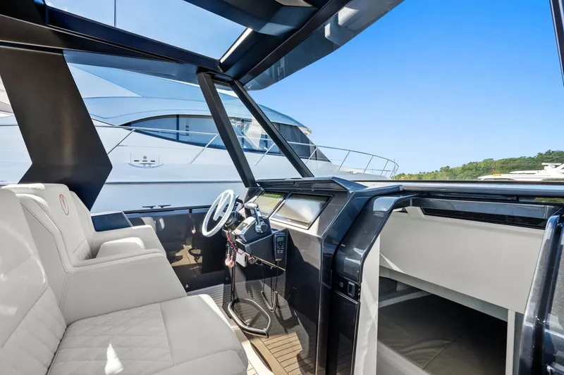Slide: The Image of 2024 Vanquish Yachts 40 interior with modern helm and luxurious seating. - 48