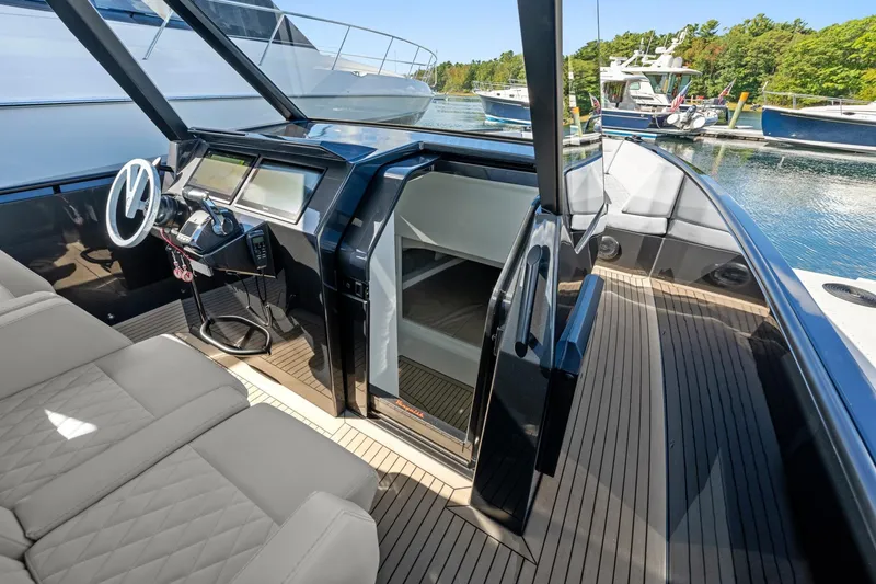 Slide: The Image of 2024 Vanquish Yachts 40 interior with sleek helm, luxurious seating, and modern design. - 51