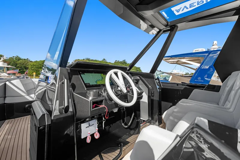 Slide: The Image of 2024 Vanquish Yachts 40 cockpit with modern steering and navigation system. - 53
