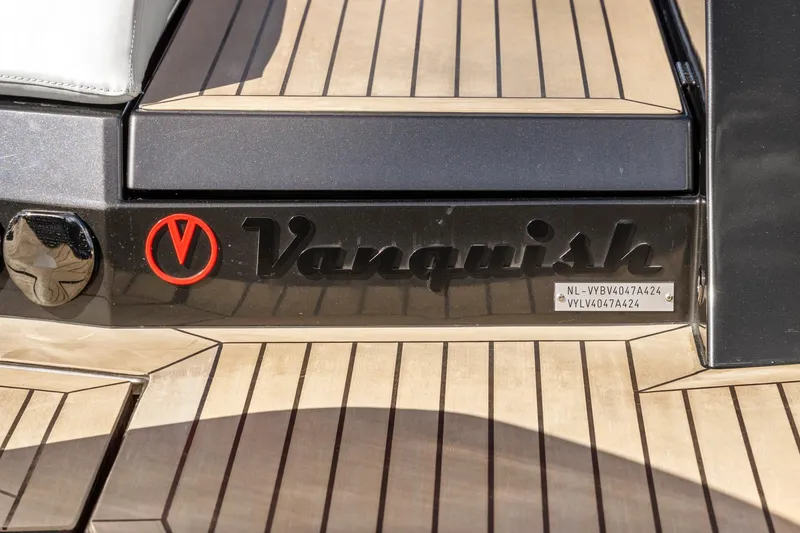 Slide: The Image of 2024 Vanquish Yachts 40, logo and details on teak deck. - 55