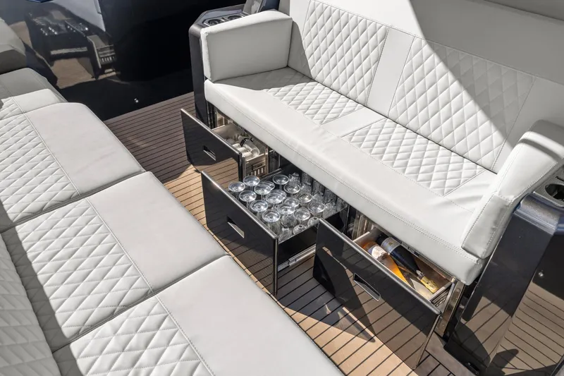 Slide: The Image of Luxurious seating with storage on 2024 Vanquish Yachts 40, featuring elegant design and functionality. - 57