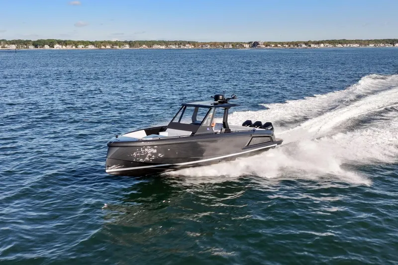 Slide: The Image of 2024 Vanquish Yachts 40 cruising on open water, showcasing sleek design and performance. - 6