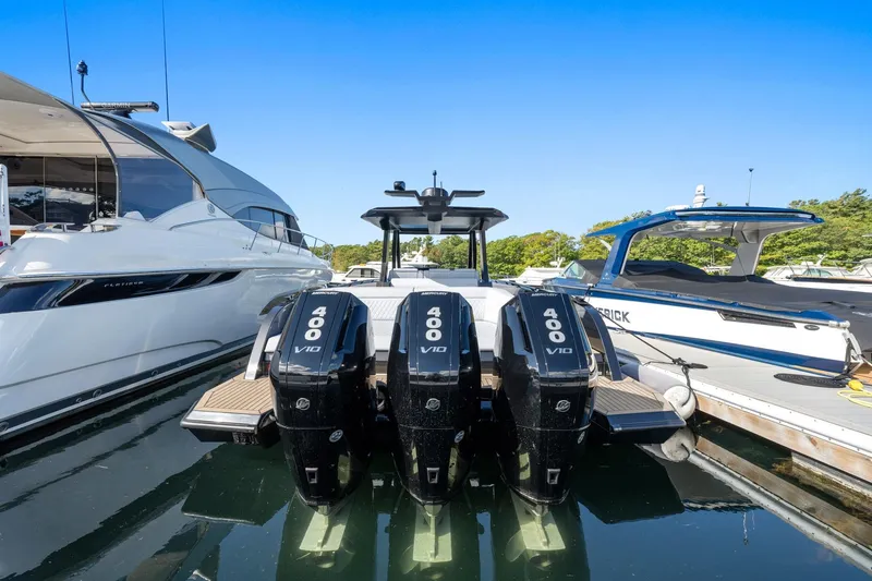 Slide: The Image of 2024 Vanquish Yachts 40 with triple 400 V10 engines docked at marina. - 63