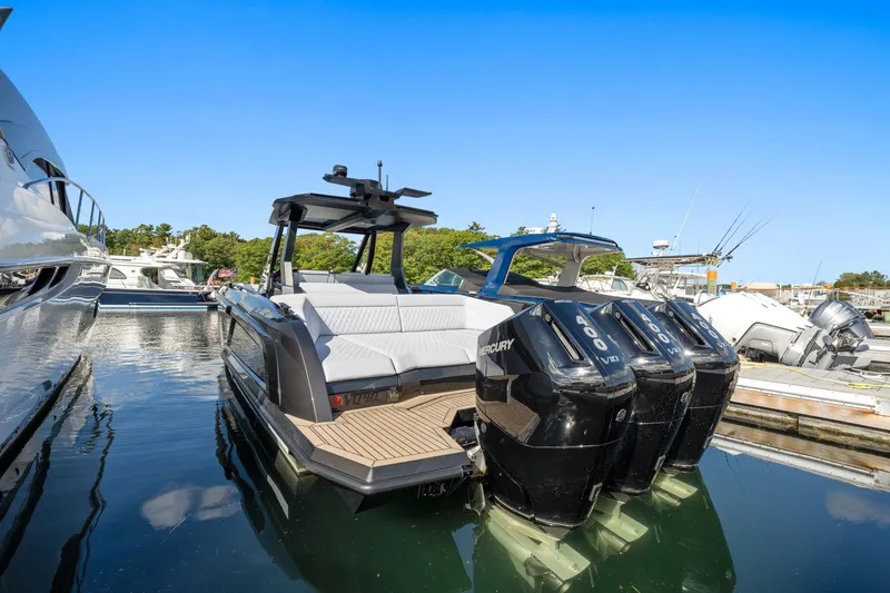 Slide: The Image of 2024 Vanquish Yachts 40 with powerful Mercury engines docked in a marina. - 64