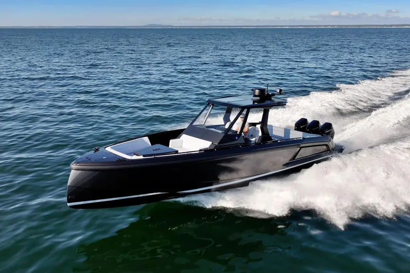 Slide: The Image of 2024 Vanquish Yachts 40 cruising on open water, showcasing sleek design and powerful performance. - 8