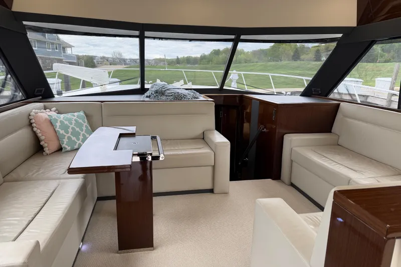Slide: The Image of Luxurious interior of 2017 Maritimo M54 yacht with plush seating and elegant wood finishes. - 10