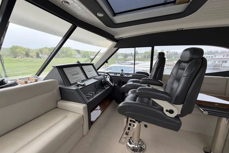 Slide: The Image of Interior of 2017 Maritimo M54 yacht with leather seating and navigation displays. - 12