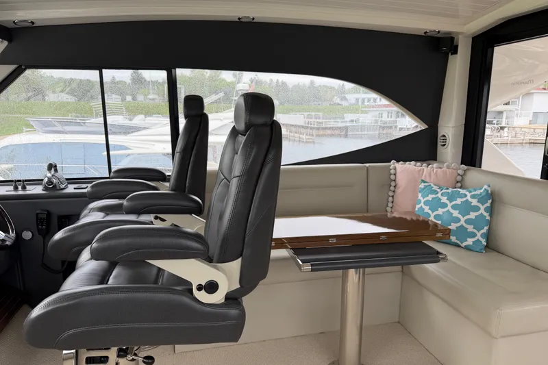 Slide: The Image of Luxurious interior of 2017 Maritimo M54 yacht with leather seating and elegant table. - 13