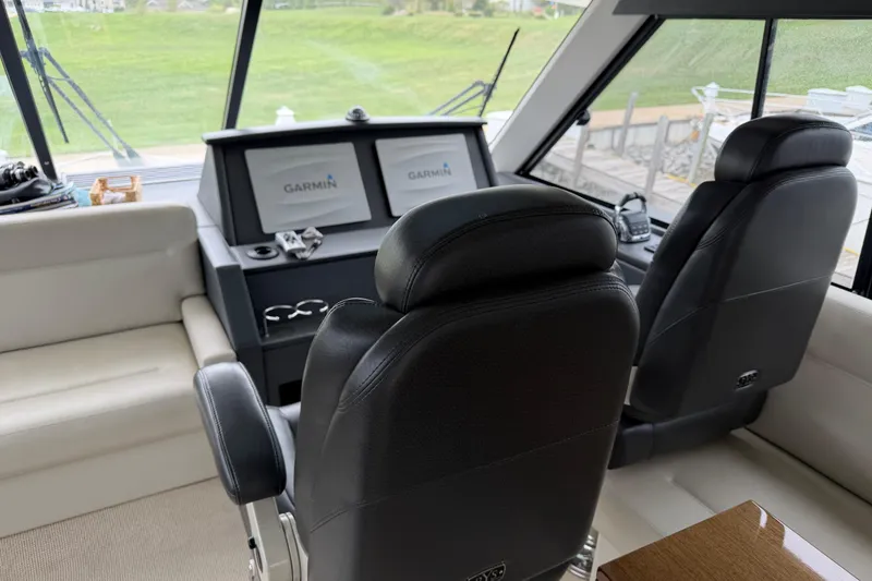 Slide: The Image of Interior of 2017 Maritimo M54 yacht with Garmin navigation system and leather seating. - 14