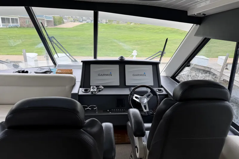 Slide: The Image of Interior view of 2017 Maritimo M54 yacht cockpit with Garmin navigation displays. - 15