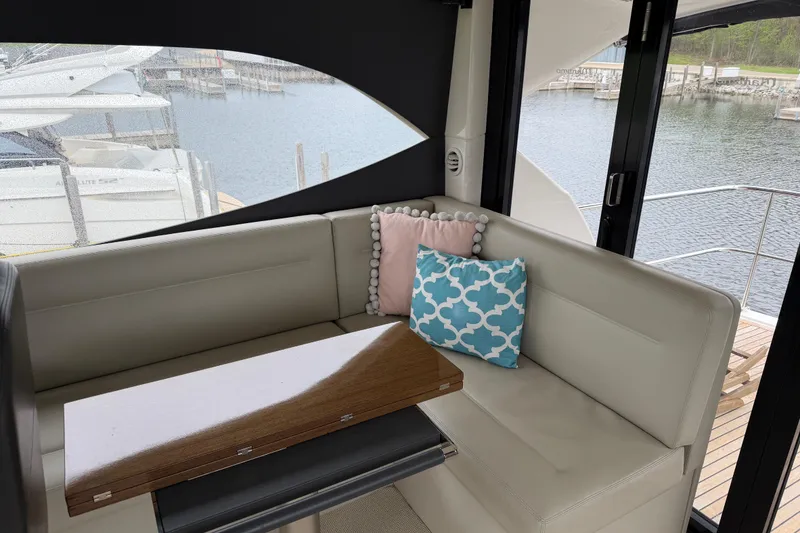 Slide: The Image of Interior of 2017 Maritimo M54 yacht with cozy seating and decorative pillows. - 16