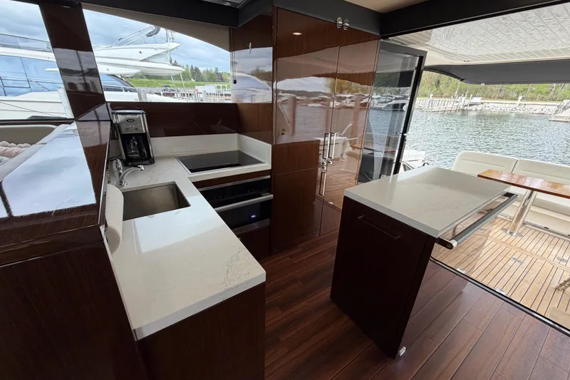 Slide: The Image of Luxurious 2017 Maritimo M54 yacht kitchen with modern appliances and waterfront view. - 5