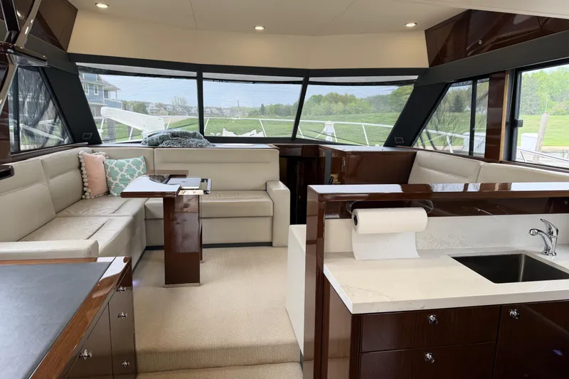 Slide: The Image of Luxurious interior of a 2017 Maritimo M54 yacht with elegant seating and modern kitchen amenities. - 8
