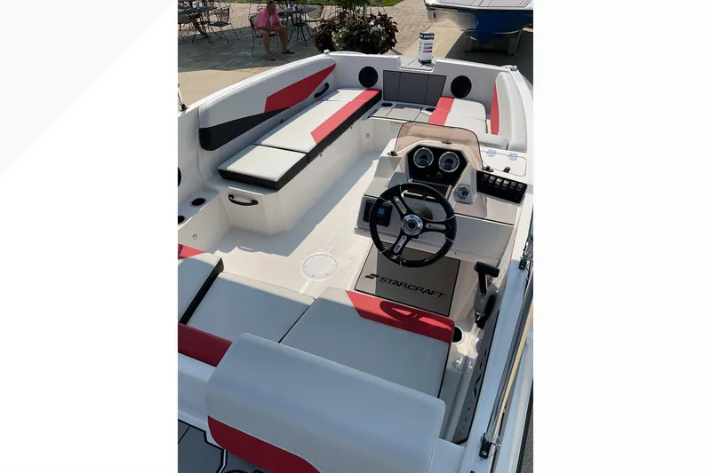 Slide: The Image of 2026 Starcraft SV 16 OB boat interior with modern dashboard and seating. - 10