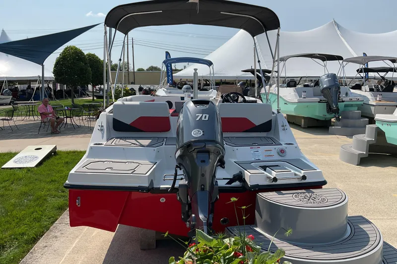 Slide: The Image of 2026 Starcraft SV 16 OB boat with 70 HP engine displayed outdoors. - 4