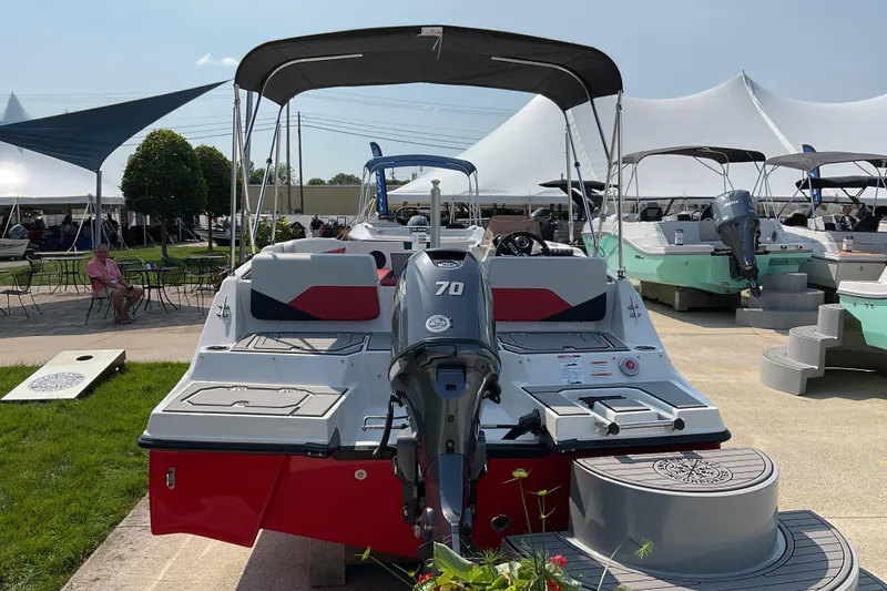 Slide: The Image of 2026 Starcraft SV 16 OB boat with outboard motor displayed at a boat show. - 5