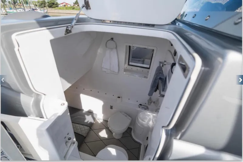 Slide: The Image of 2020 Midnight Express 37 Open boat interior bathroom with modern amenities. - 4
