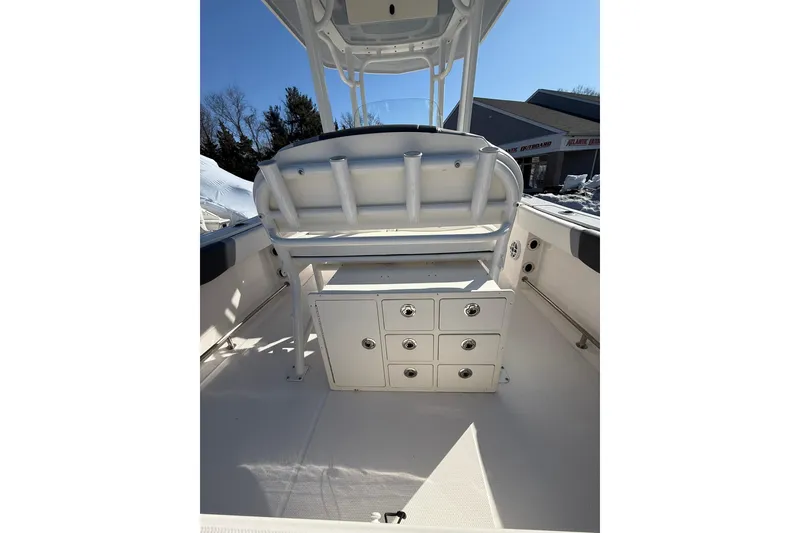 Slide: The Image of 2022 Robalo R230 Center Console boat interior with storage compartments. - 23