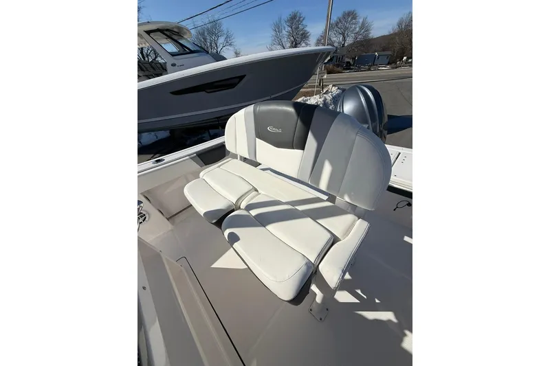 Slide: The Image of 2022 Robalo R230 Center Console boat with white and gray seating. - 27