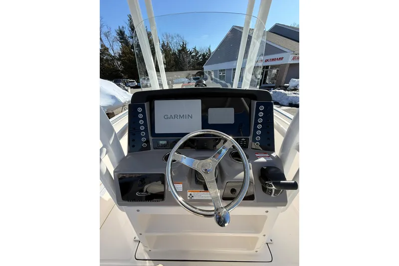 Slide: The Image of 2022 Robalo R230 Center Console boat dashboard with Garmin navigation system. - 28