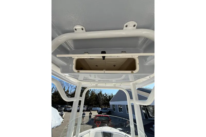 Slide: The Image of 2022 Robalo R230 Center Console boat's overhead storage compartment. - 32