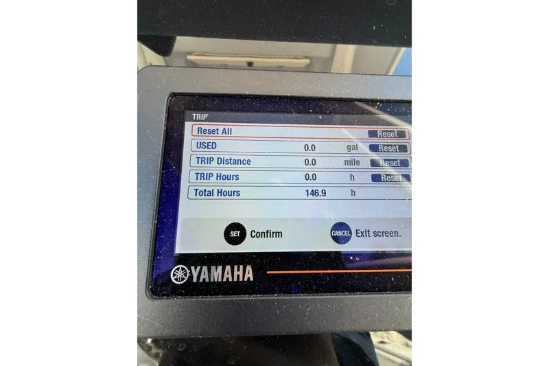 Slide: The Image of Yamaha display on 2022 Robalo R230 Center Console showing trip and total hours. - 33