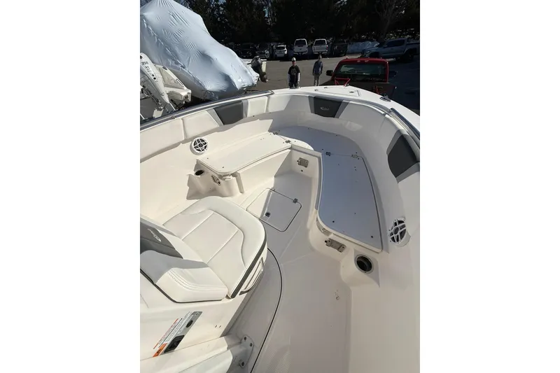 Slide: The Image of 2022 Robalo R230 Center Console boat interior with seating and storage compartments. - 34