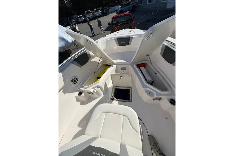 Slide: The Image of 2022 Robalo R230 Center Console boat interior with open storage compartments. - 39