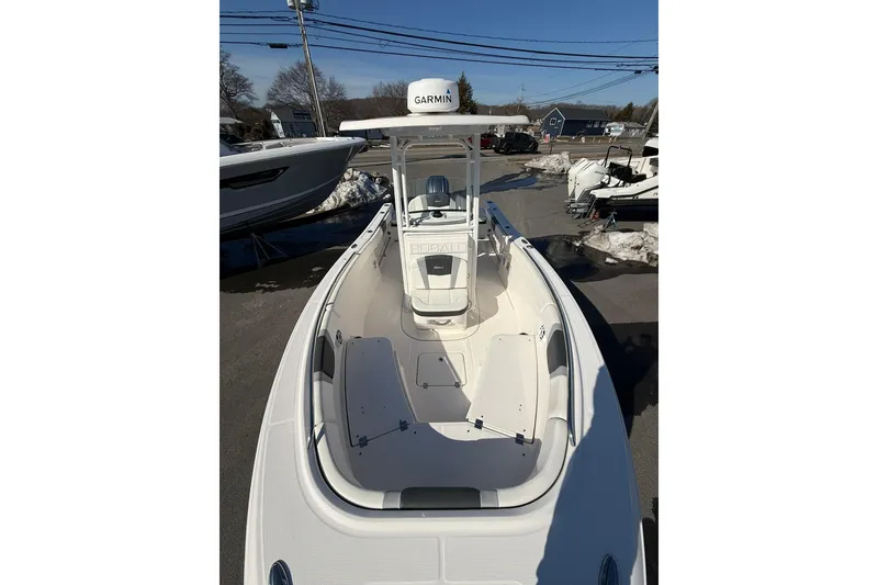 Slide: The Image of 2022 Robalo R230 Center Console boat with Garmin equipment, docked outdoors. - 41