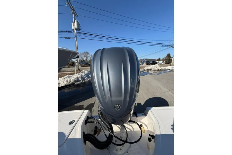 Slide: The Image of 2022 Robalo R230 Center Console boat with Yamaha outboard motor, parked on a sunny day. - 42