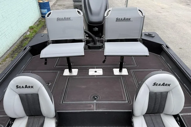 Slide: The Image of 2026 SeaArk Flex 21 Pro boat interior with four seats and sleek design. - 10